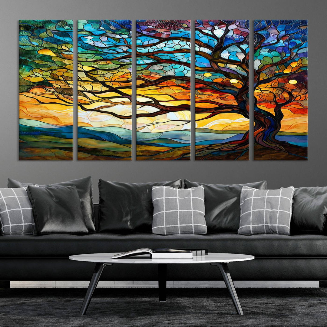 A vivid Tree of Life in stained glass style is depicted with twisted branches, a colorful sky, and hills on a ready-to-hang canvas.