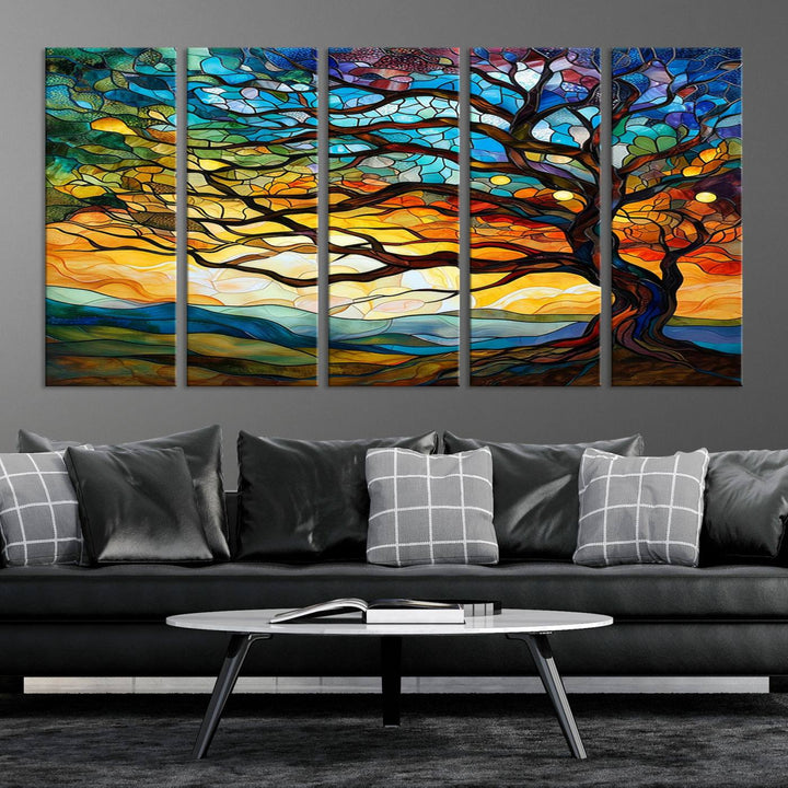 A vivid Tree of Life in stained glass style is depicted with twisted branches, a colorful sky, and hills on a ready-to-hang canvas.