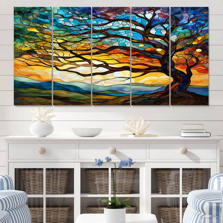 A vivid Tree of Life in stained glass style is depicted with twisted branches, a colorful sky, and hills on a ready-to-hang canvas.