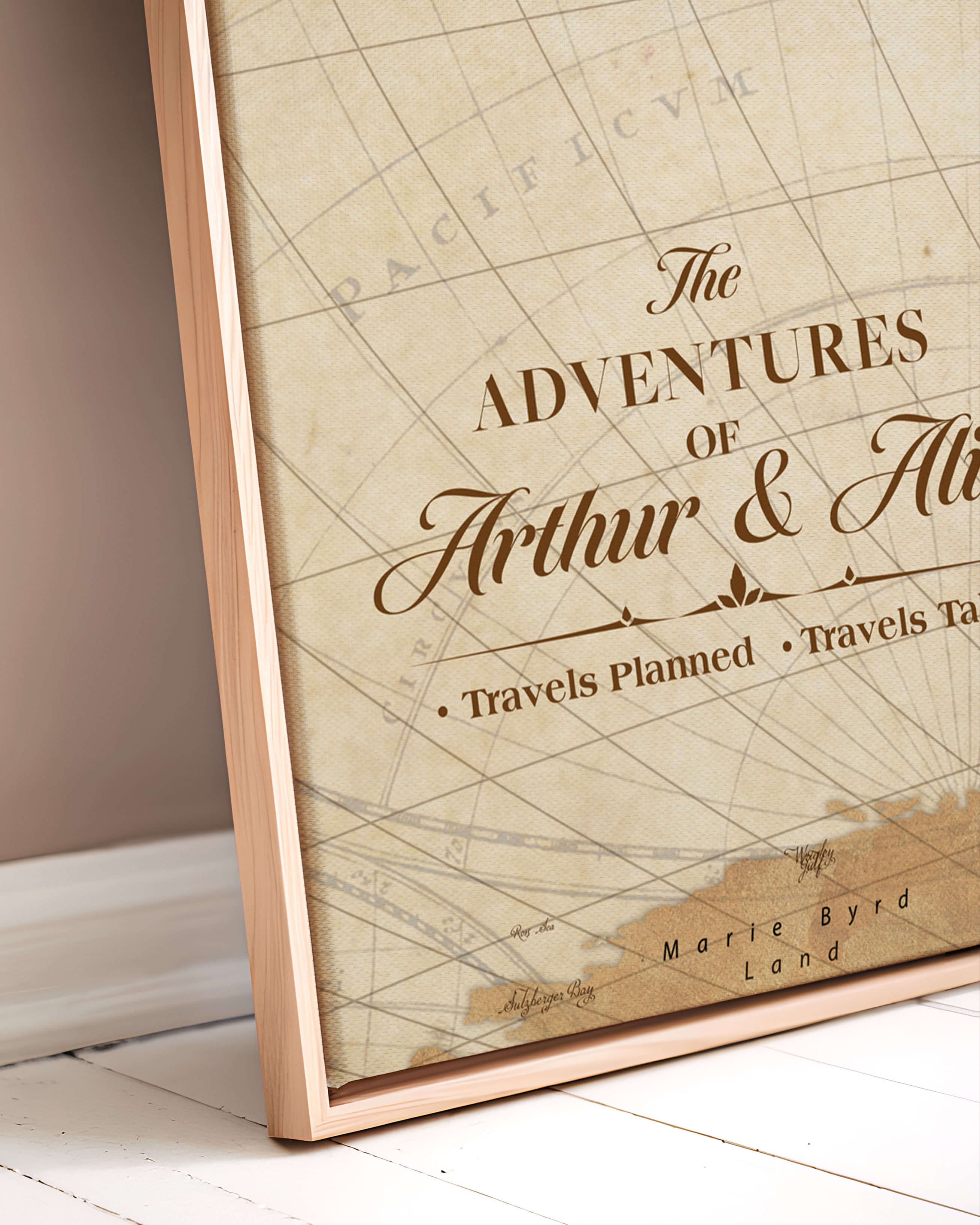 Framed map with 'The Adventures of Arthur & Ali' text on a beige wall.