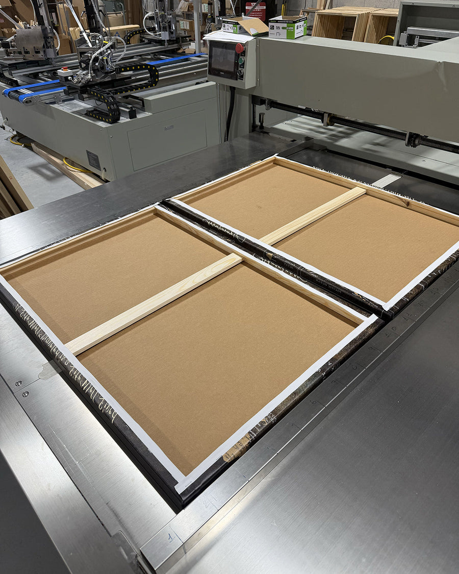 Hand stretching and framing a canvas