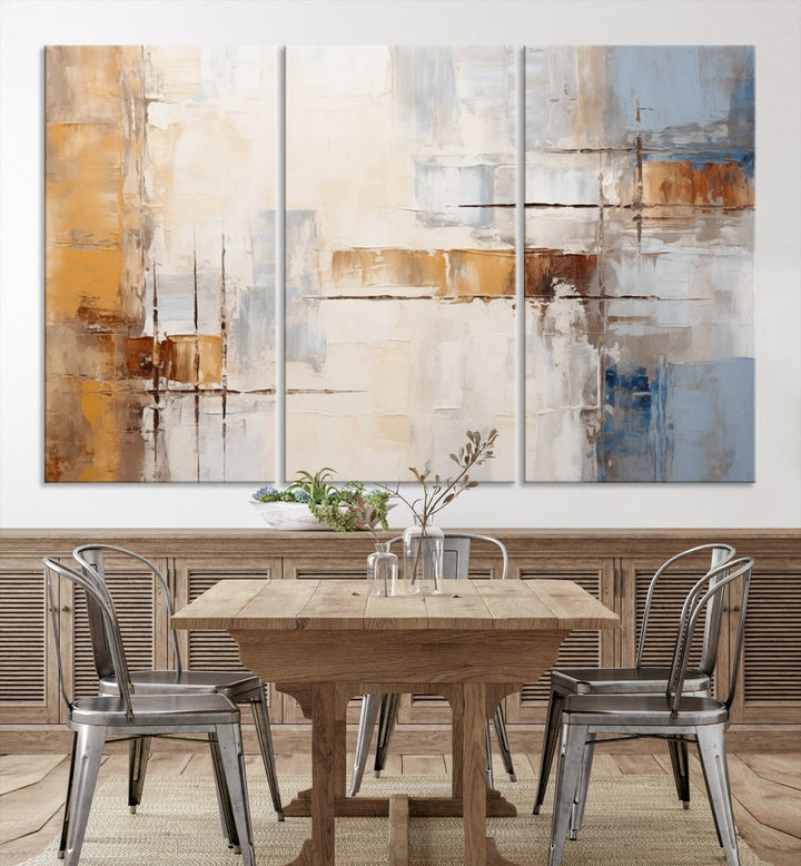 The Pastel Abstract Multi Panel Wall Art Canvas Print, featuring blue, white, and brown tones on museum-quality canvas, is ready to hang and includes a UV-protective coating for enduring vibrancy.