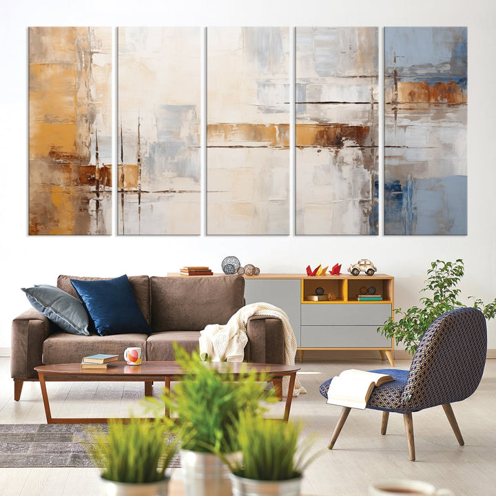 The Pastel Abstract Multi Panel Wall Art Canvas Print, featuring blue, white, and brown tones on museum-quality canvas, is ready to hang and includes a UV-protective coating for enduring vibrancy.