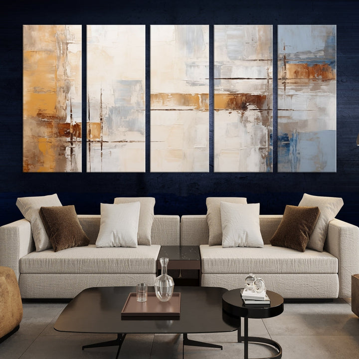 The Pastel Abstract Multi Panel Wall Art Canvas Print, featuring blue, white, and brown tones on museum-quality canvas, is ready to hang and includes a UV-protective coating for enduring vibrancy.