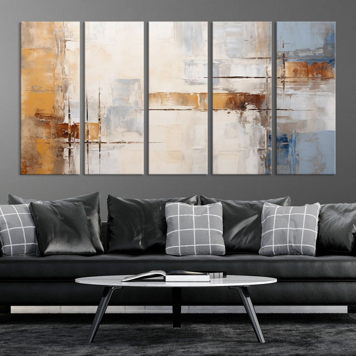 The Pastel Abstract Multi Panel Wall Art Canvas Print, featuring blue, white, and brown tones on museum-quality canvas, is ready to hang and includes a UV-protective coating for enduring vibrancy.