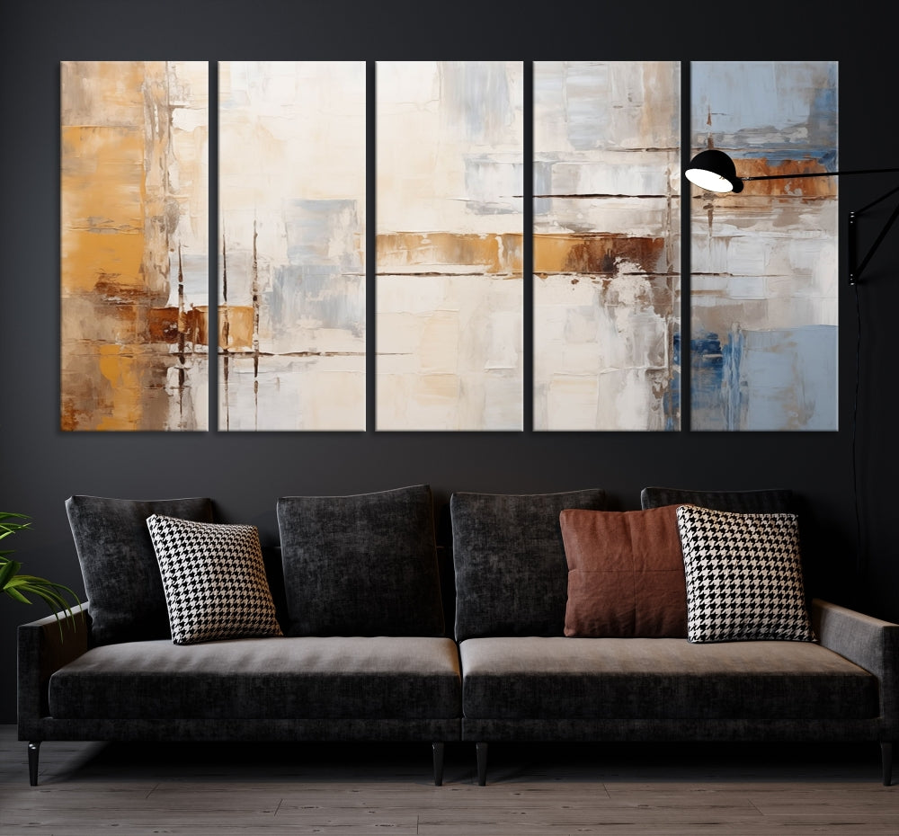 The Pastel Abstract Multi Panel Wall Art Canvas Print, featuring blue, white, and brown tones on museum-quality canvas, is ready to hang and includes a UV-protective coating for enduring vibrancy.