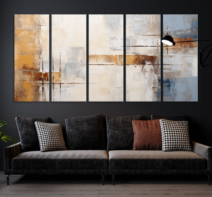 The Pastel Abstract Multi Panel Wall Art Canvas Print, featuring blue, white, and brown tones on museum-quality canvas, is ready to hang and includes a UV-protective coating for enduring vibrancy.