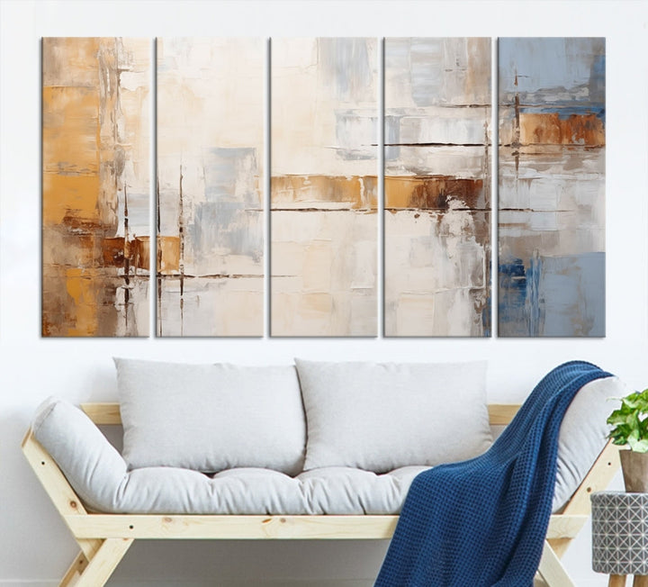 The Pastel Abstract Multi Panel Wall Art Canvas Print, featuring blue, white, and brown tones on museum-quality canvas, is ready to hang and includes a UV-protective coating for enduring vibrancy.